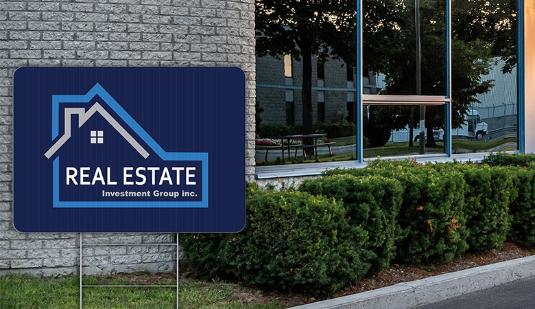 real estate yard sign in front of business