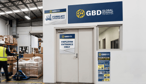 warehouse wall with different blue and yellow ultraboard warehouse signs
