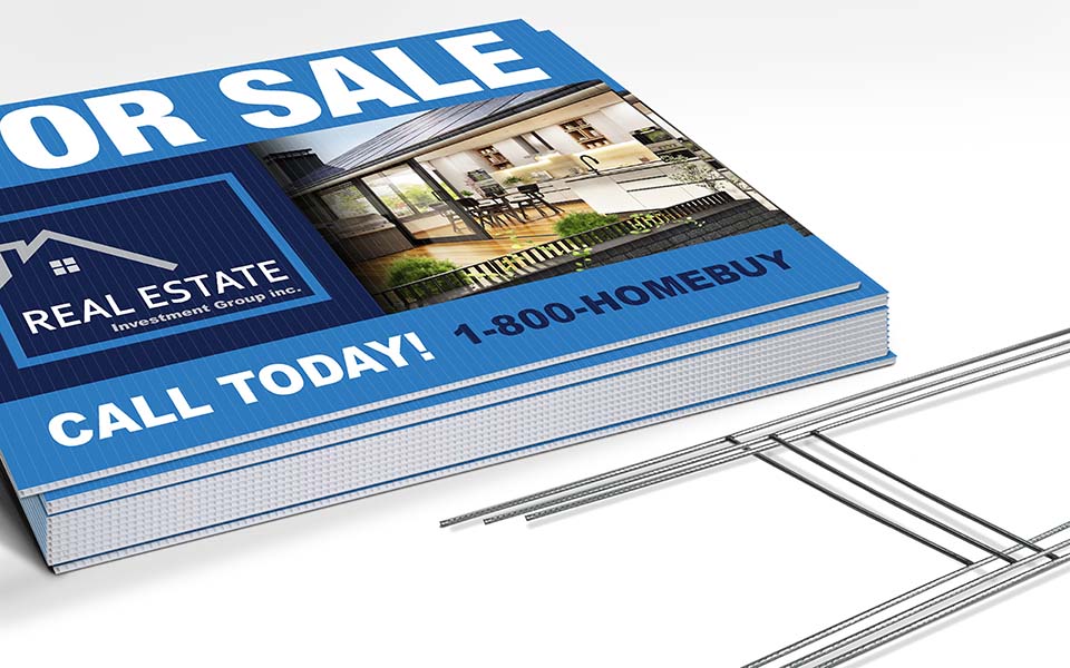stack of yard signs and stakes on white background