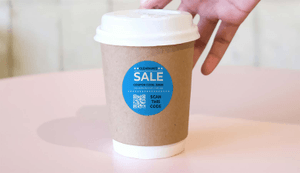 blue circle sale qr code sticker on coffee cup