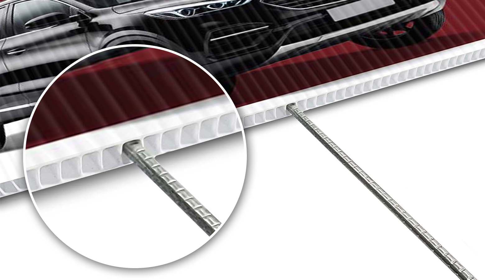 zoomed in circle showing the edge of coroplast with an h frame stake