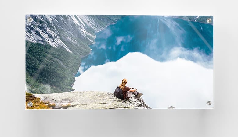 acrylic photo of adventurer on top of mountain