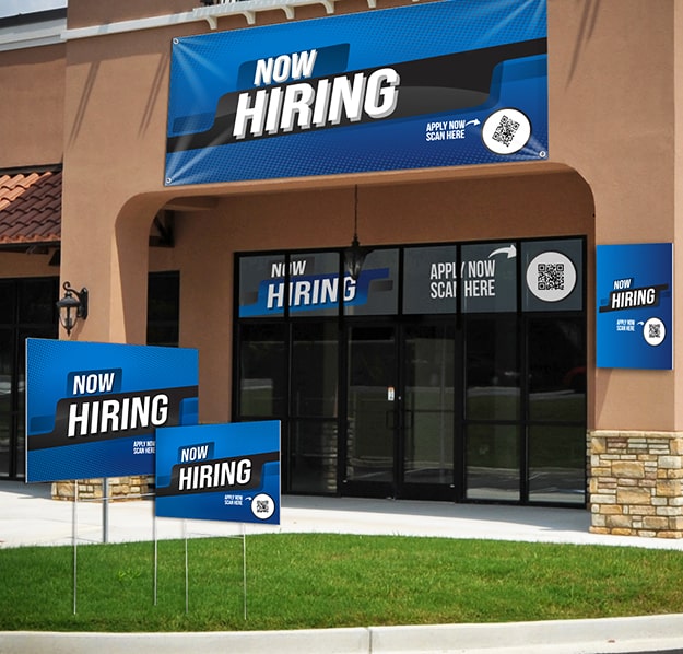 variety of now hiring sign types on display in front of a business